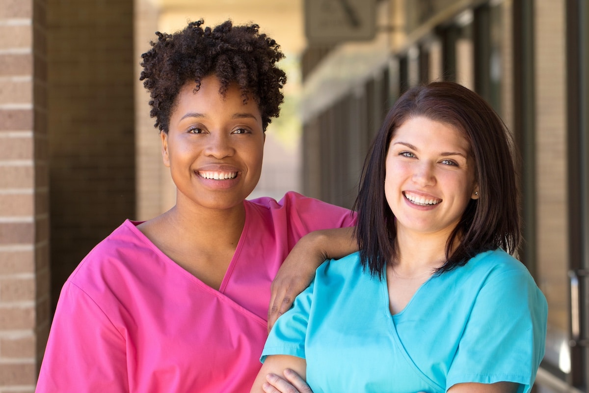 women who work in a hospital, smiling - reduce stress