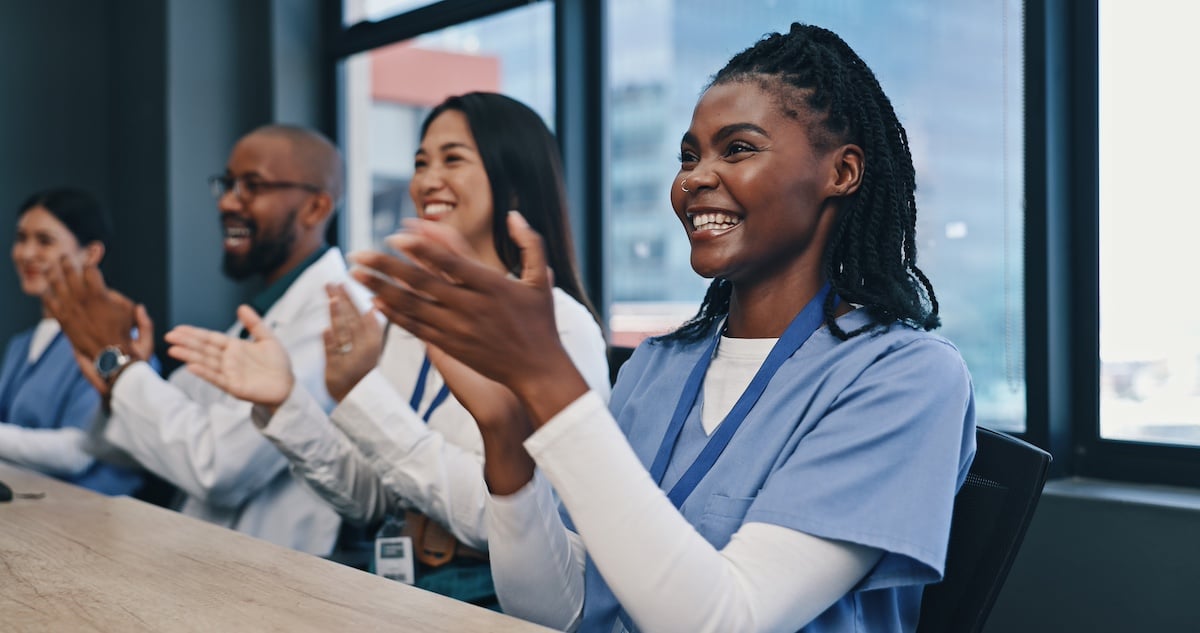 Teamwork, applause with nurses and doctors meeting with diversity, congratulations and support in onboarding. Medical achievement, men and nurses in office clapping hands at hospital and healthcare. -